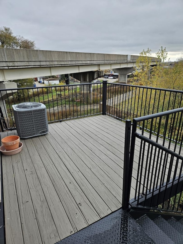wooden deck with central AC unit