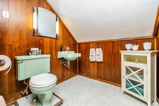 3730 Wenonah Ave, Berwyn, IL 60402 - bathroom with marble look tiles, wood walls, toilet, and a sink
