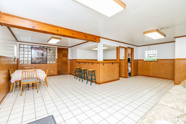 3730 Wenonah Ave, Berwyn, IL 60402 - additional living space featuring a wainscoted wall, wooden walls, and tile patterned floors