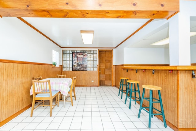 3730 Wenonah Ave, Berwyn, IL 60402 - dining area featuring wainscoting, wooden walls, and light flooring