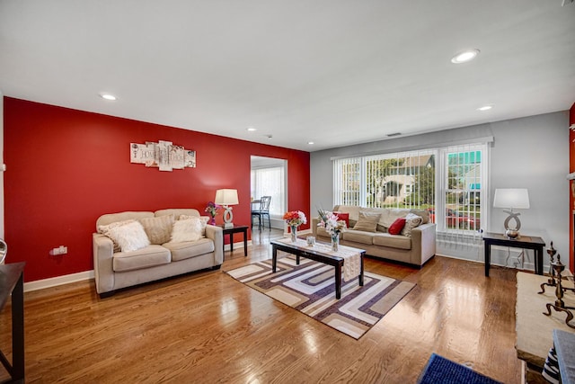 1636 S 14th Ave, Maywood, IL 60153 - living area featuring an accent wall, wood finished floors, recessed lighting, and baseboards