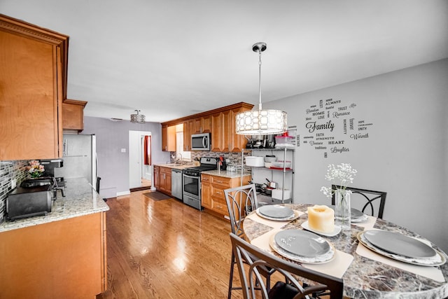 1636 S 14th Ave, Maywood, IL 60153 - dining area with light wood-style floors