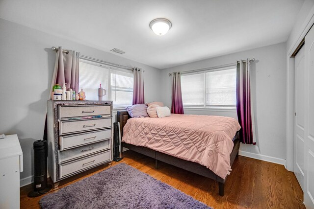 1636 S 14th Ave, Maywood, IL 60153 - bedroom featuring a closet, wood finished floors, and baseboards