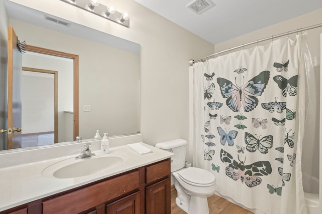 223 Aspen Cir, Gilberts, IL 60136 - full bathroom with wood finished floors, toilet, and vanity