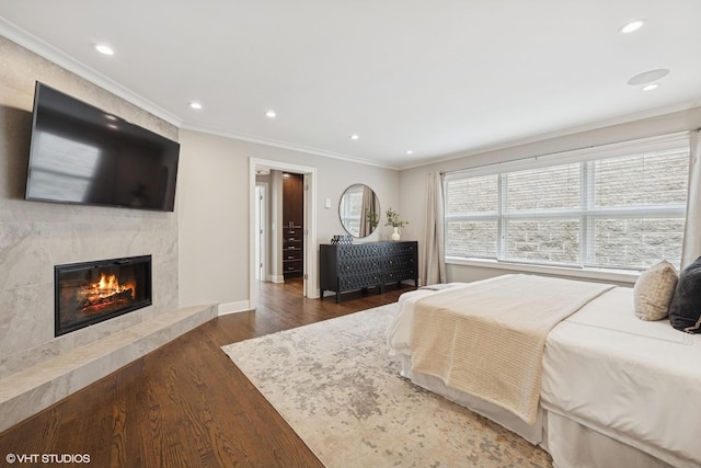 1048 W Webster Ave, Chicago, IL 60614 - bedroom featuring a premium fireplace, wood finished floors, recessed lighting, baseboards, and ornamental molding