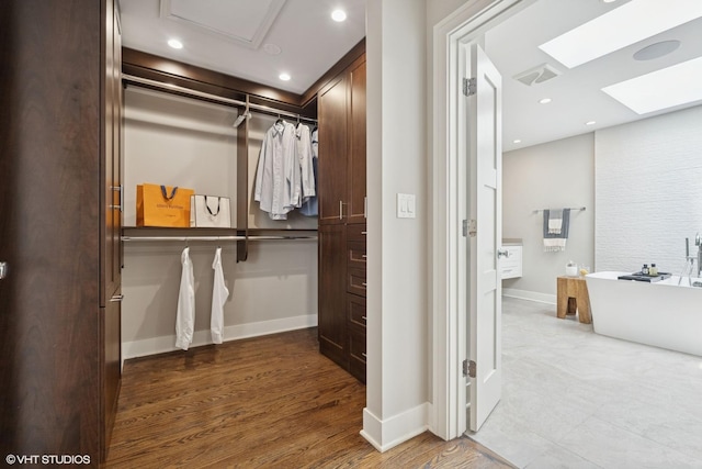 1048 W Webster Ave, Chicago, IL 60614 - spacious closet with a skylight, wood finished floors, and elevator