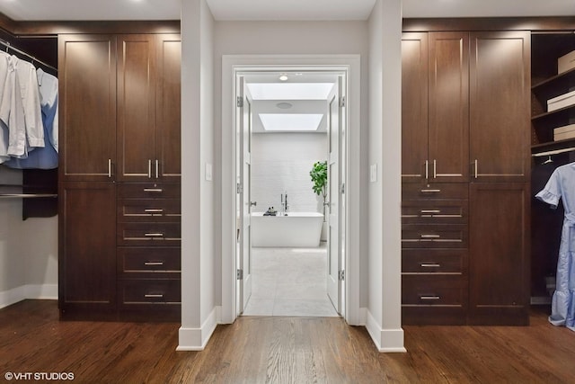 1048 W Webster Ave, Chicago, IL 60614 - walk in closet with dark wood-style flooring