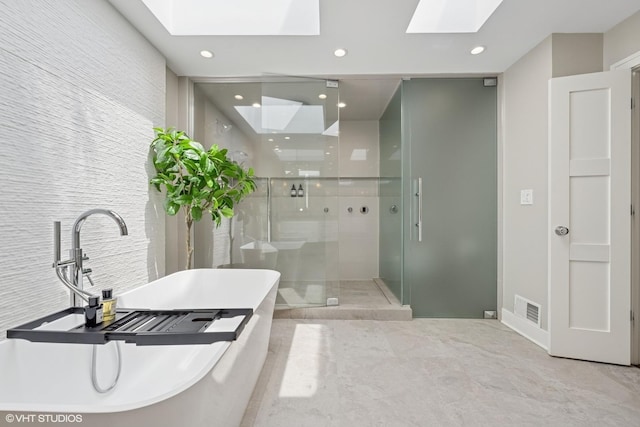 1048 W Webster Ave, Chicago, IL 60614 - full bath featuring a skylight, a stall shower, a soaking tub, and recessed lighting