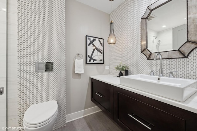 1048 W Webster Ave, Chicago, IL 60614 - bathroom featuring vanity, baseboards, wood finished floors, and toilet