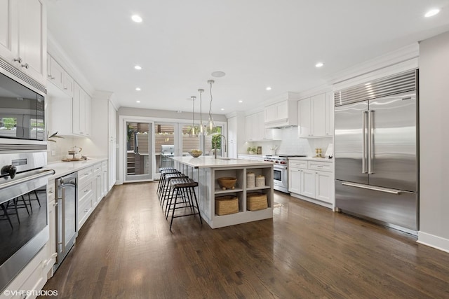 1048 W Webster Ave, Chicago, IL 60614 - kitchen with built in appliances, tasteful backsplash, recessed lighting, light countertops, and white cabinets