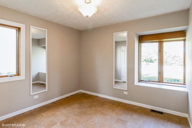 1179 Pegwood Dr, Elgin, IL 60120 - spare room with baseboards and a textured ceiling