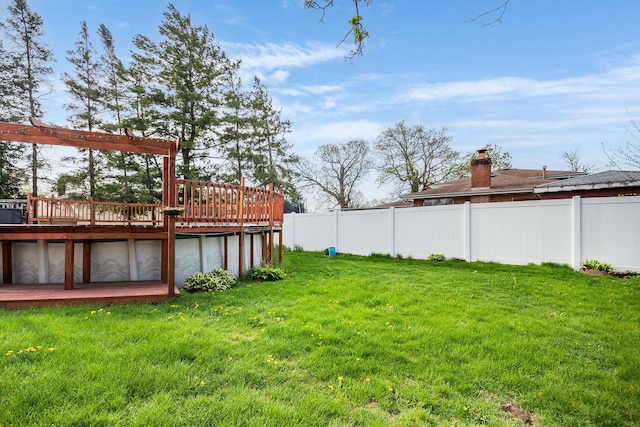 view of yard featuring a wooden deck