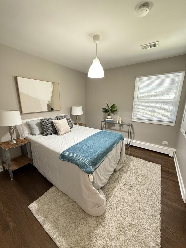 11 S Roberts Rd, Inverness, IL 60067 - bedroom with a baseboard radiator, wood finished floors, and baseboards