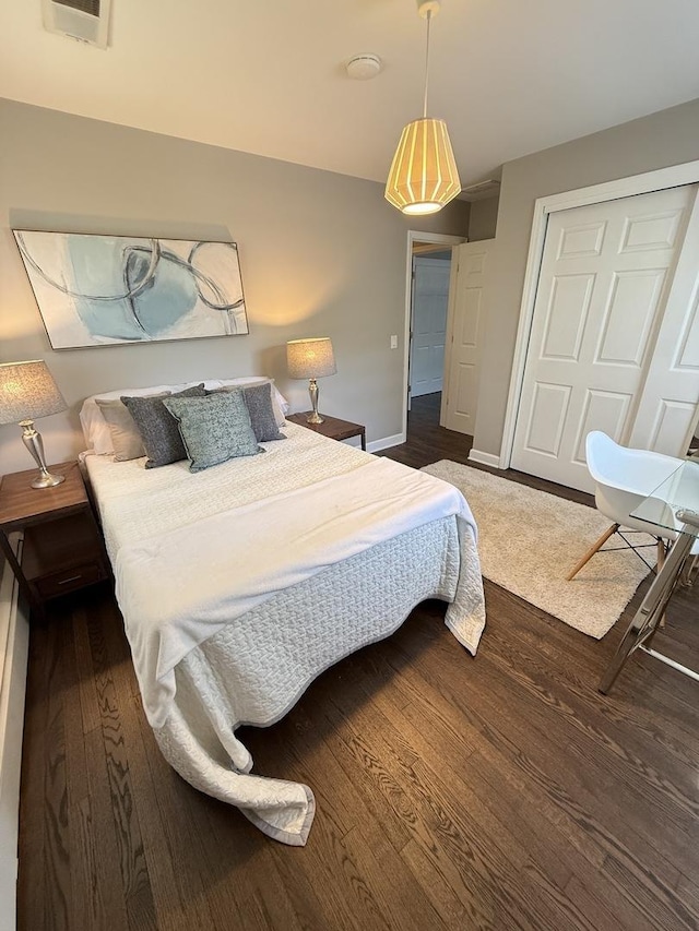 11 S Roberts Rd, Inverness, IL 60067 - bedroom with wood finished floors, baseboards, and a closet