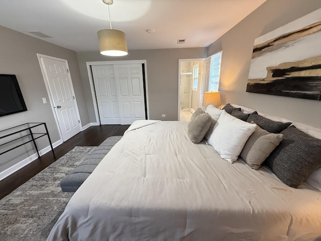 11 S Roberts Rd, Inverness, IL 60067 - bedroom featuring wood finished floors, a closet, connected bathroom, and baseboards