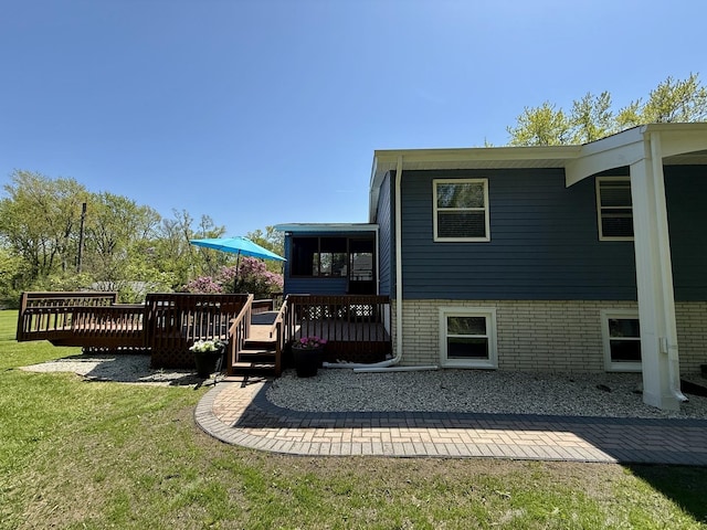 11 S Roberts Rd, Inverness, IL 60067 - back of house featuring a deck, a yard, and a sunroom