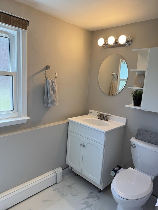 11 S Roberts Rd, Inverness, IL 60067 - half bath featuring a baseboard heating unit, healthy amount of natural light, marble look tile flooring, and toilet