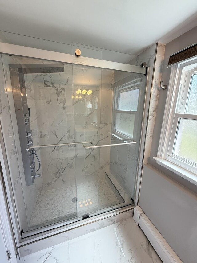 11 S Roberts Rd, Inverness, IL 60067 - bathroom with marble look tiles, healthy amount of natural light, a marble finish shower, and a baseboard heating unit