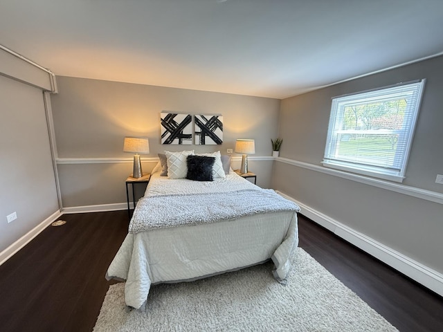 11 S Roberts Rd, Inverness, IL 60067 - bedroom with dark wood finished floors, baseboards, and baseboard heating