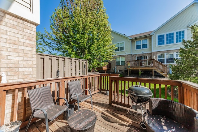 deck featuring a grill