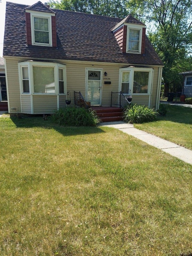 14636 Clark St, Dolton, IL 60419 - cape cod house featuring a front yard