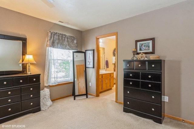 1722 John St, Yorkville, IL 60560 - bedroom featuring light carpet, baseboards, and connected bathroom