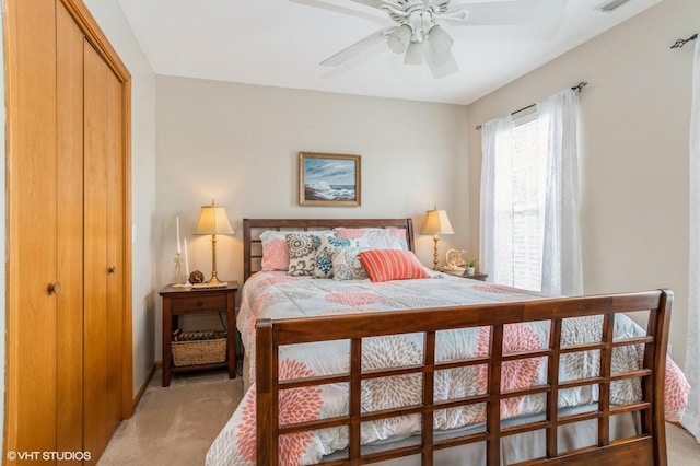 1722 John St, Yorkville, IL 60560 - bedroom featuring light carpet, a closet, baseboards, and ceiling fan