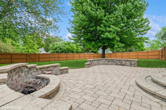 1722 John St, Yorkville, IL 60560 - view of patio / terrace featuring a fire pit and a fenced backyard