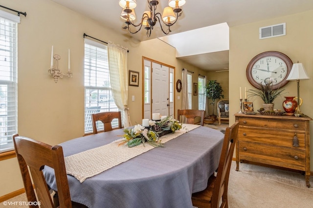 1722 John St, Yorkville, IL 60560 - dining space with a chandelier and carpet floors
