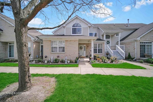 1677 Brightwood Pl Unit 8B, Aurora, IL 60506 - view of front of house featuring brick siding and a front yard