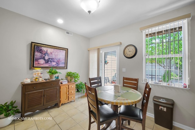 1677 Brightwood Pl Unit 8B, Aurora, IL 60506 - dining space featuring light tile patterned floors and baseboards