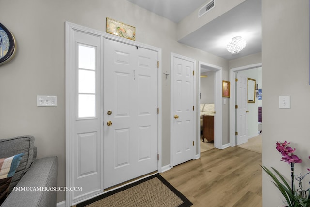 1677 Brightwood Pl Unit 8B, Aurora, IL 60506 - entrance foyer featuring light wood-type flooring and baseboards