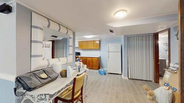 6 N Melrose Ave, Elgin, IL 60123 - dining space featuring light wood-style floors and baseboards