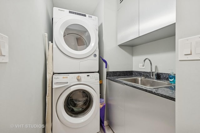 1122 N Clark St Unit 3301-10, Chicago, IL 60610 - laundry room with stacked washing machine and dryer and cabinet space