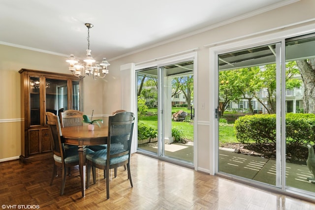 708 Newgate Ln Unit A, Prospect Heights, IL 60070 - dining space featuring a chandelier, ornamental molding, and baseboards
