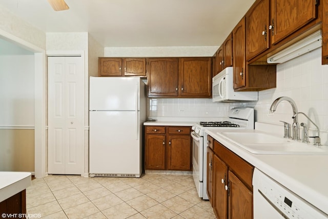 708 Newgate Ln Unit A, Prospect Heights, IL 60070 - kitchen with white appliances, light countertops, a sink, and decorative backsplash