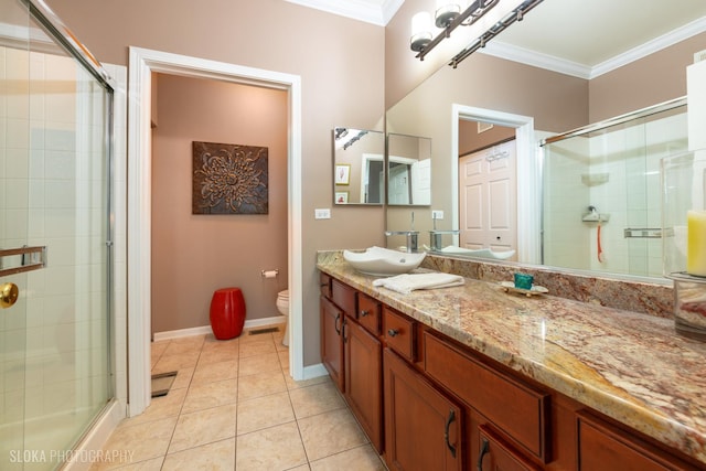 2253 Concord Dr, Mchenry, IL 60050 - bathroom featuring crown molding, toilet, a shower stall, vanity, and tile patterned flooring