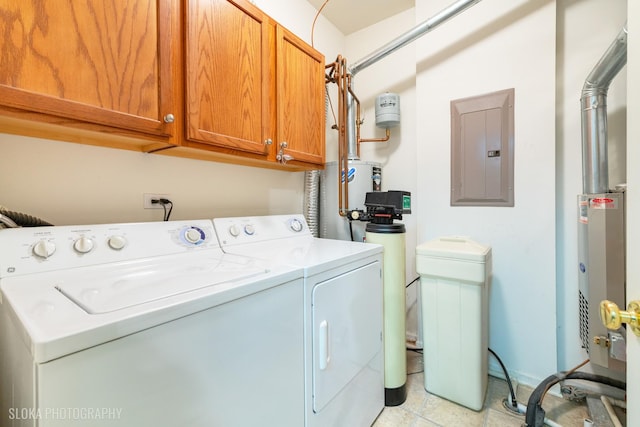 2253 Concord Dr, Mchenry, IL 60050 - clothes washing area with electric panel, washing machine and dryer, water heater, cabinet space, and light tile patterned flooring