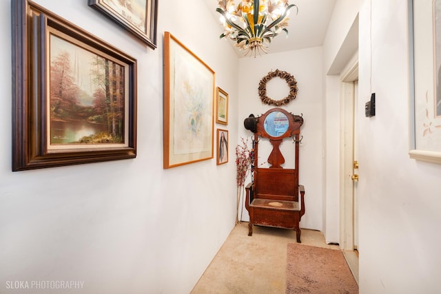 2253 Concord Dr, Mchenry, IL 60050 - hallway featuring a chandelier and light carpet