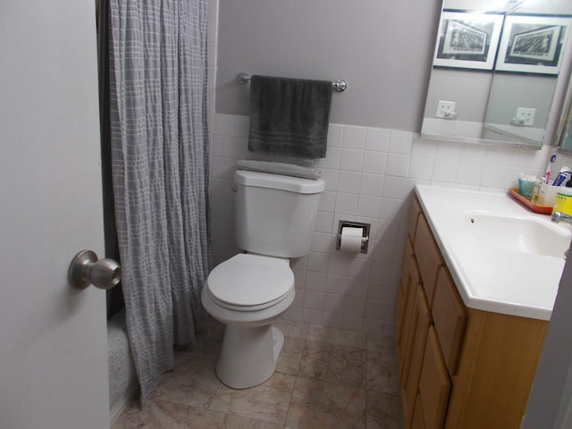 5455 N Sheridan Rd Unit 408, Chicago, IL 60640 - full bath with tile walls, toilet, vanity, a shower with shower curtain, and wainscoting
