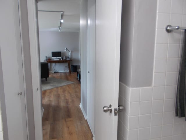 5455 N Sheridan Rd Unit 408, Chicago, IL 60640 - corridor with wood finished floors, rail lighting, and a desk