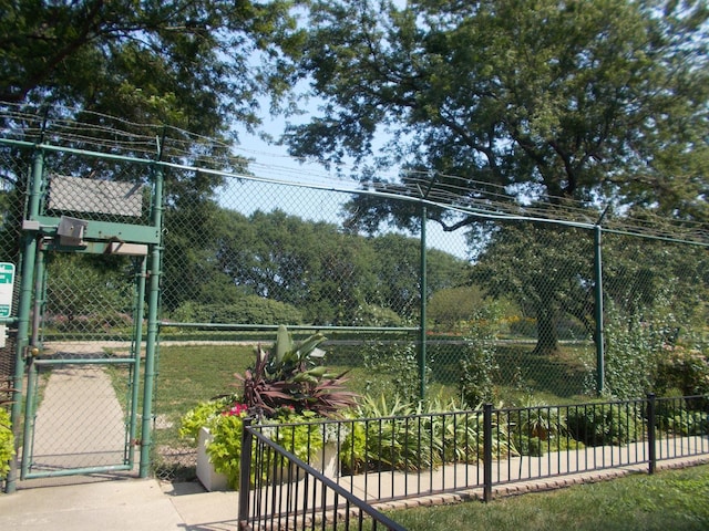 5455 N Sheridan Rd Unit 408, Chicago, IL 60640 - view of tennis court with a gate and fence