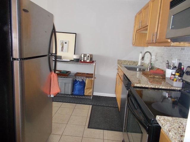 5455 N Sheridan Rd Unit 408, Chicago, IL 60640 - kitchen featuring appliances with stainless steel finishes, a sink, backsplash, light tile patterned flooring, and baseboards