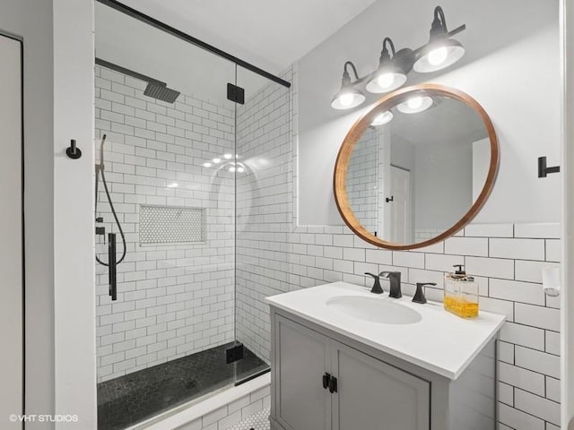 1811 Maplewood Ct, Lindenhurst, IL 60046 - bathroom with a stall shower, vanity, and tile walls