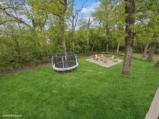 1811 Maplewood Ct, Lindenhurst, IL 60046 - view of yard featuring a trampoline, an outdoor fire pit, and a patio