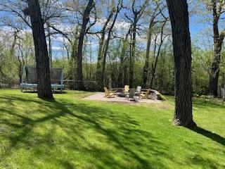 1811 Maplewood Ct, Lindenhurst, IL 60046 - view of green lawn featuring a trampoline