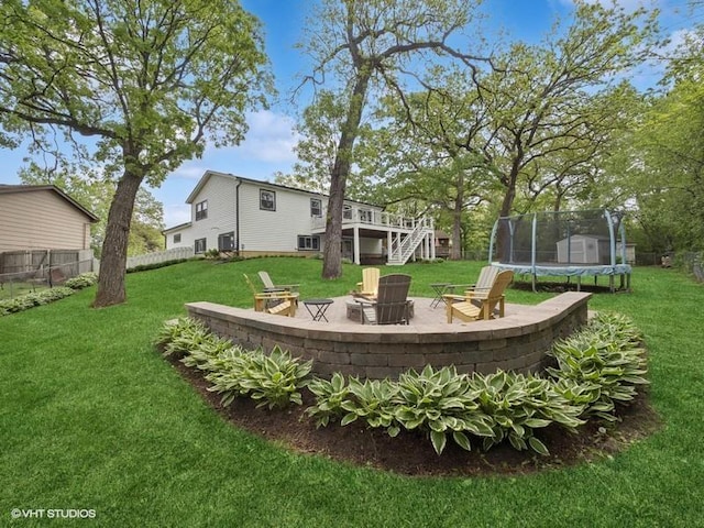 1811 Maplewood Ct, Lindenhurst, IL 60046 - view of yard with an outdoor fire pit, a trampoline, stairway, a patio area, and a deck