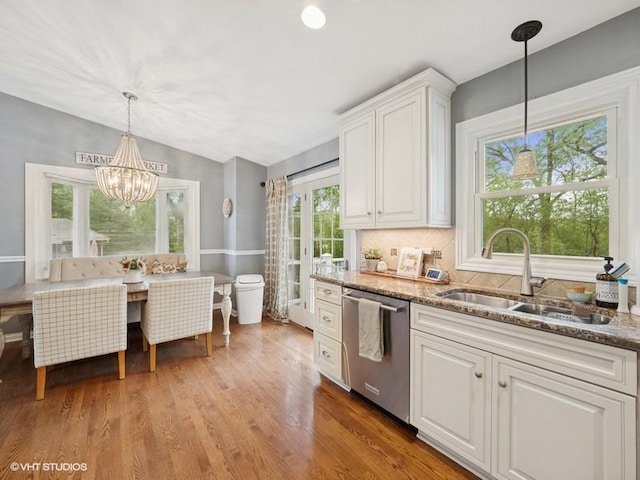 1811 Maplewood Ct, Lindenhurst, IL 60046 - kitchen with stainless steel dishwasher, a sink, white cabinets, vaulted ceiling, and stone counters