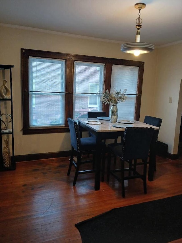 929 Garfield Pl, Danville, IL 61832 - dining space with plenty of natural light, ornamental molding, baseboards, and wood finished floors