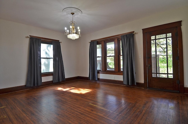 2573 State Route 17th Hwy, Toluca, IL 61369 - unfurnished room featuring a chandelier, plenty of natural light, and baseboards